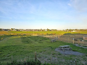 Non-electric grass and earth tent pitch
