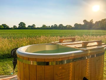Private wood-fired hot tub with far-reaching views