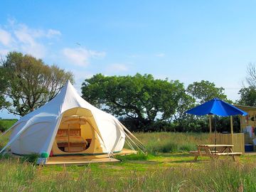 Private outdoor kitchen, firepit, picnic table and toilet facilities adjacent to each tent