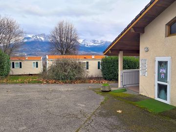 Site facilities backed by snow-capped peaks