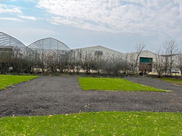Electric hardstanding and grass touring pitch