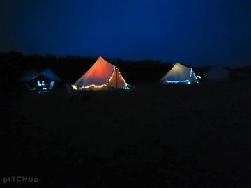 Bell tents by night