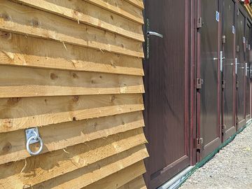 Shower block with dog tie-down point