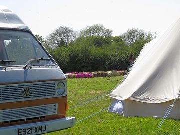 VW camper in campsite field