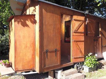 Shepherd hut eco compost toilets,hot high pressure showers and windowed wash basin, power points.