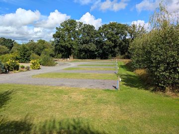 Electric hardstanding and grass pitches