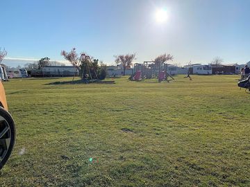 Touring grass pitch near playground