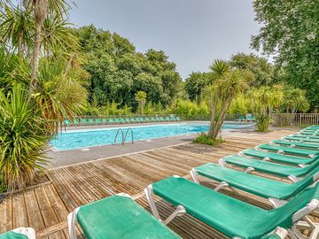 Pool with decking and loungers