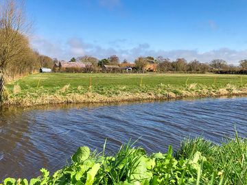 Station Farm as seen from the old railway line which runs along the river