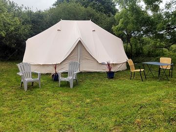 Bell tent with outdoor chairs