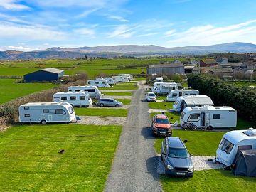 Electric hardstanding and grass pitches