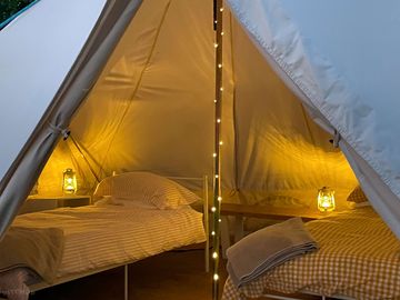 Bell tent interior with twin beds