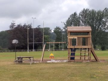 Play area and grass pitches for tents, campervans and touring caravans