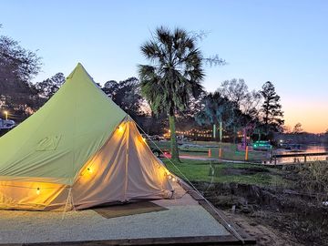 Golden hour at the lake—your cozy glamping tent, just steps from the water.