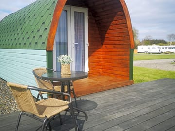 Acorn Pod with decking and bistro set to enjoy the view
