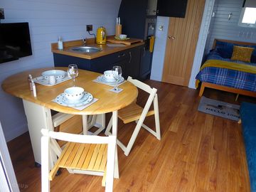Stow away table pulls out to easily accommodate up to 4 people