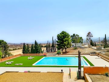 Site's swimming pool and view of the pitches