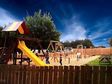 Play area with slides and swings