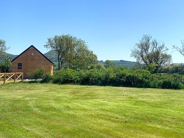 Lodges next to a grassy space