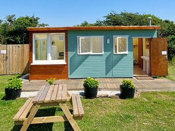 Clean shower & toilet block. the wash up area being on the left