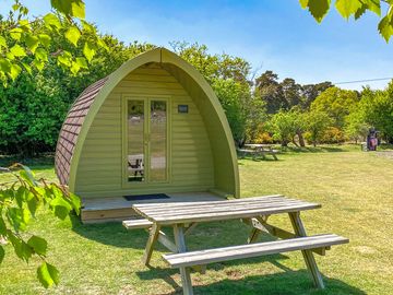 Pea pod with picnic benches for guests use with parking space.