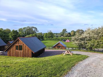 Lodges and camping pitch in the back