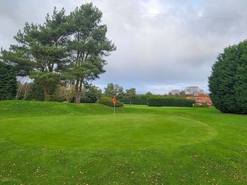 View of the roost clubhouse from the 12th green