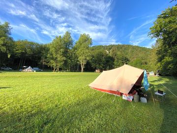 Tent pitch by the river