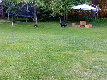 Trampoline, covered seating and firepit