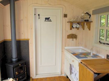 The kitchen area inside the shepherd's hut