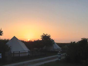 Sunset over the bell tents