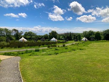 Just 3 beautiful lotus belle tents in acres of green space