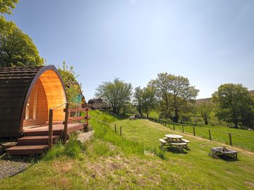 Outdoor seating in front of the pods