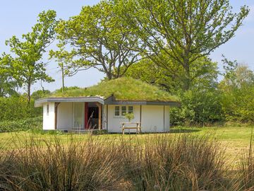 Roundhouse surrounded by greenery