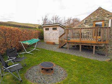 Garden and balcony with hot tub is now situated in front of the left wooden building