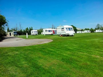 Electric grass pitches in the sun