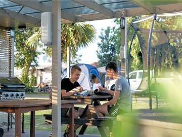 Communal barbecue space with seating