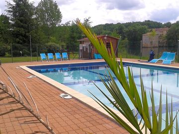 Swimming pool with chairs and loungers