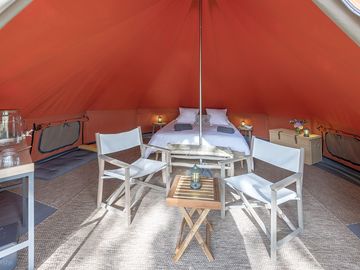 Tent with double bed, storage and seating