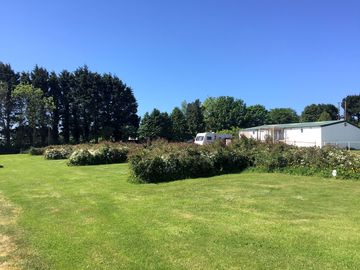 Low hedges separate the grass pitches