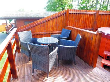 Deck with outdoor furniture and hot tub