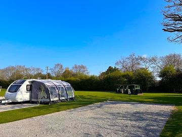 Seven electric hard standing pitches near the play area