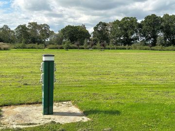 Mitchell's field grass tent pitch with EHU
