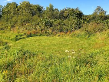 Grass and gravel tent pitch