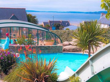Indoor and outdoor pools with views of the sea
