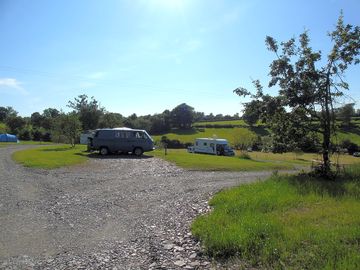 Campervans, caravans and motorhomes on their pitches