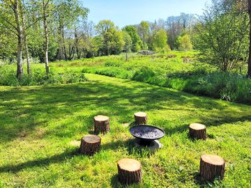 Firepit and grill provided for barbecues