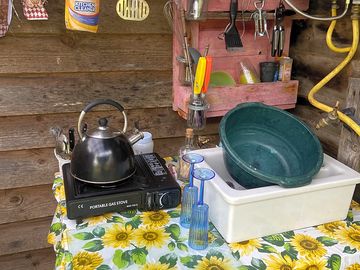 The camp kitchenette with gas camping stove
