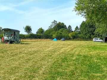 Grass camping field with toilet block