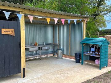 Washing up area with hot water and honesty shop.